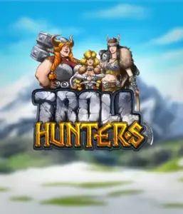 Изображение игрового автомата "Troll Hunters" от Play'N Go, где изображены три воина-викинга: две женщины и один мужчина, облаченные в традиционные викингские доспехи. За их спинами виднеются горные вершины, что создаёт атмосферу северных легенд. Этот слот идеален для любителей скандинавской культуры и поисков приключений.